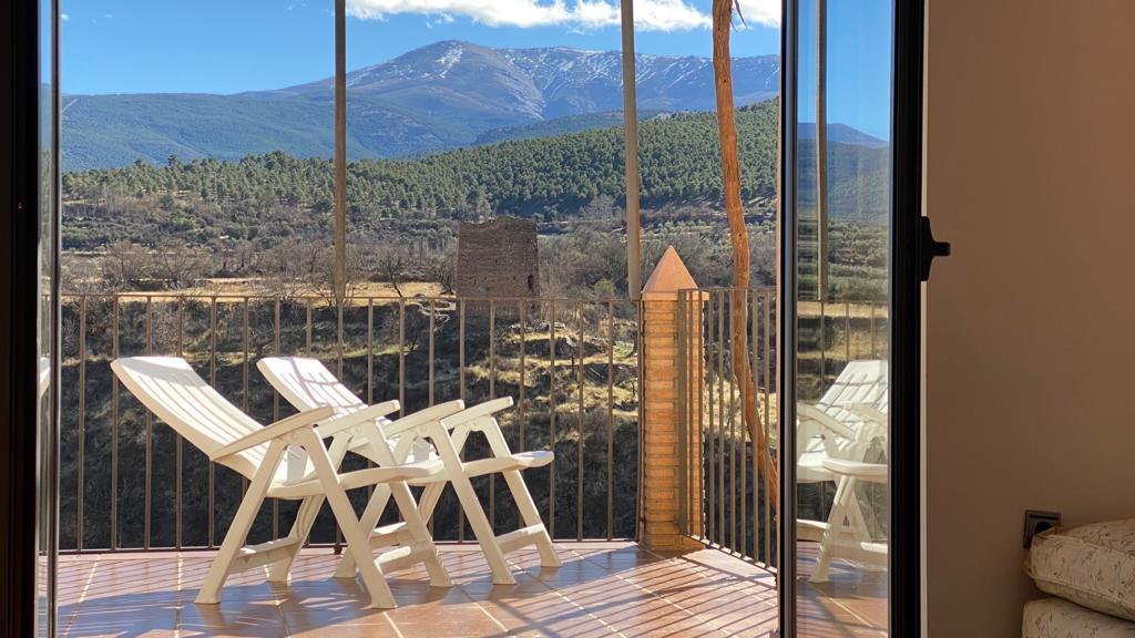 SALON PUERTA A TERRAZA con torre de alcazar